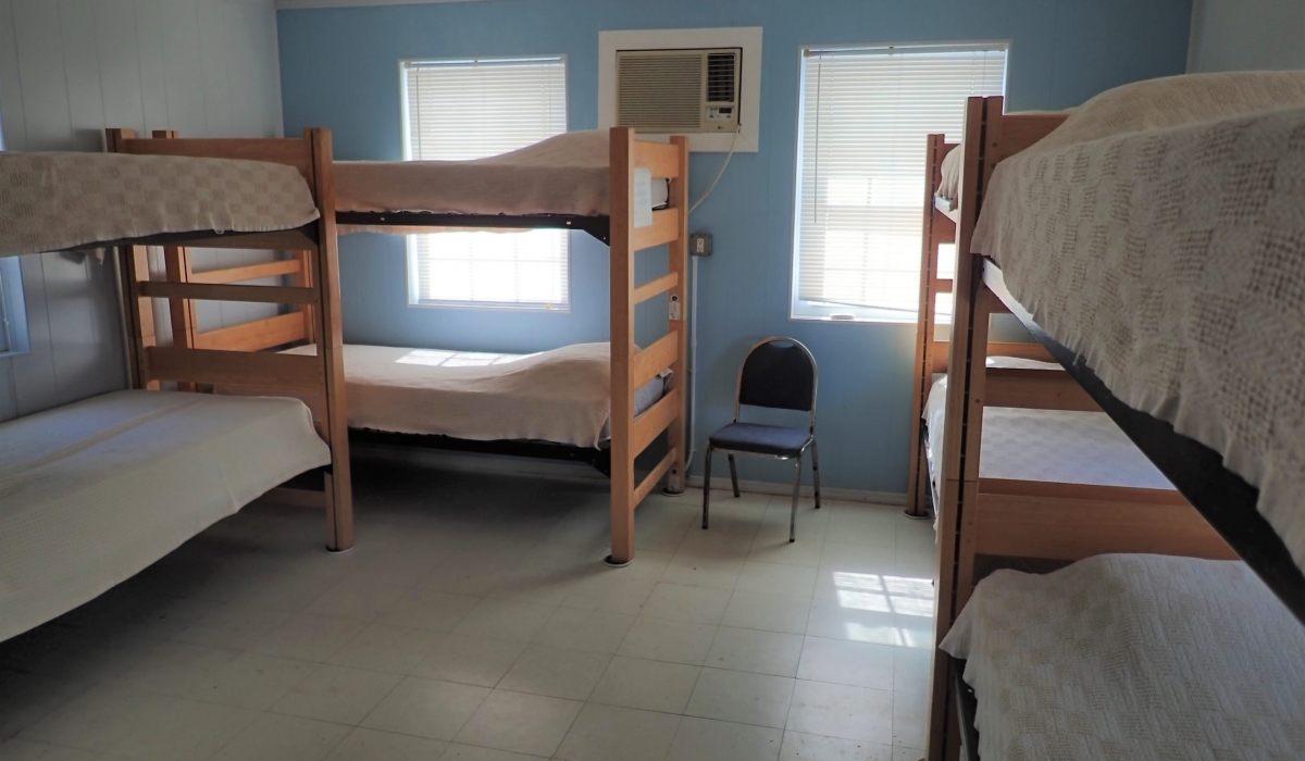 The bedroom sleeps 8 dorm style (4 bunk beds).