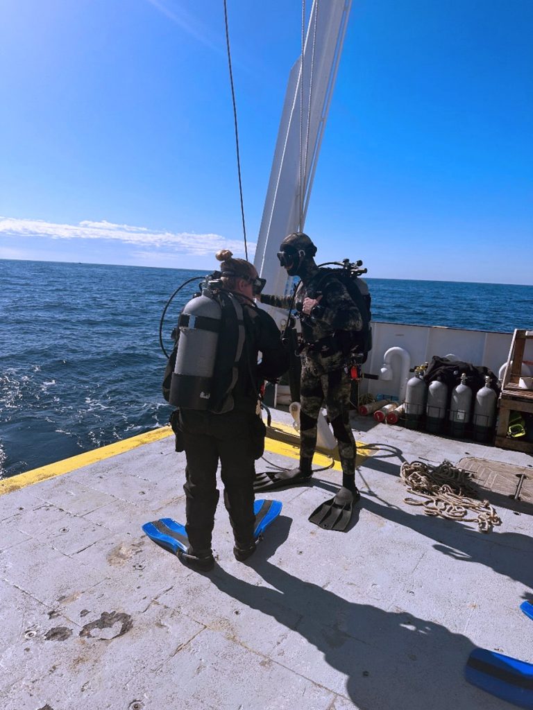Figure 3. Researchers SCUBA dive to assess the below surface impact of the hurricane (FGCU).